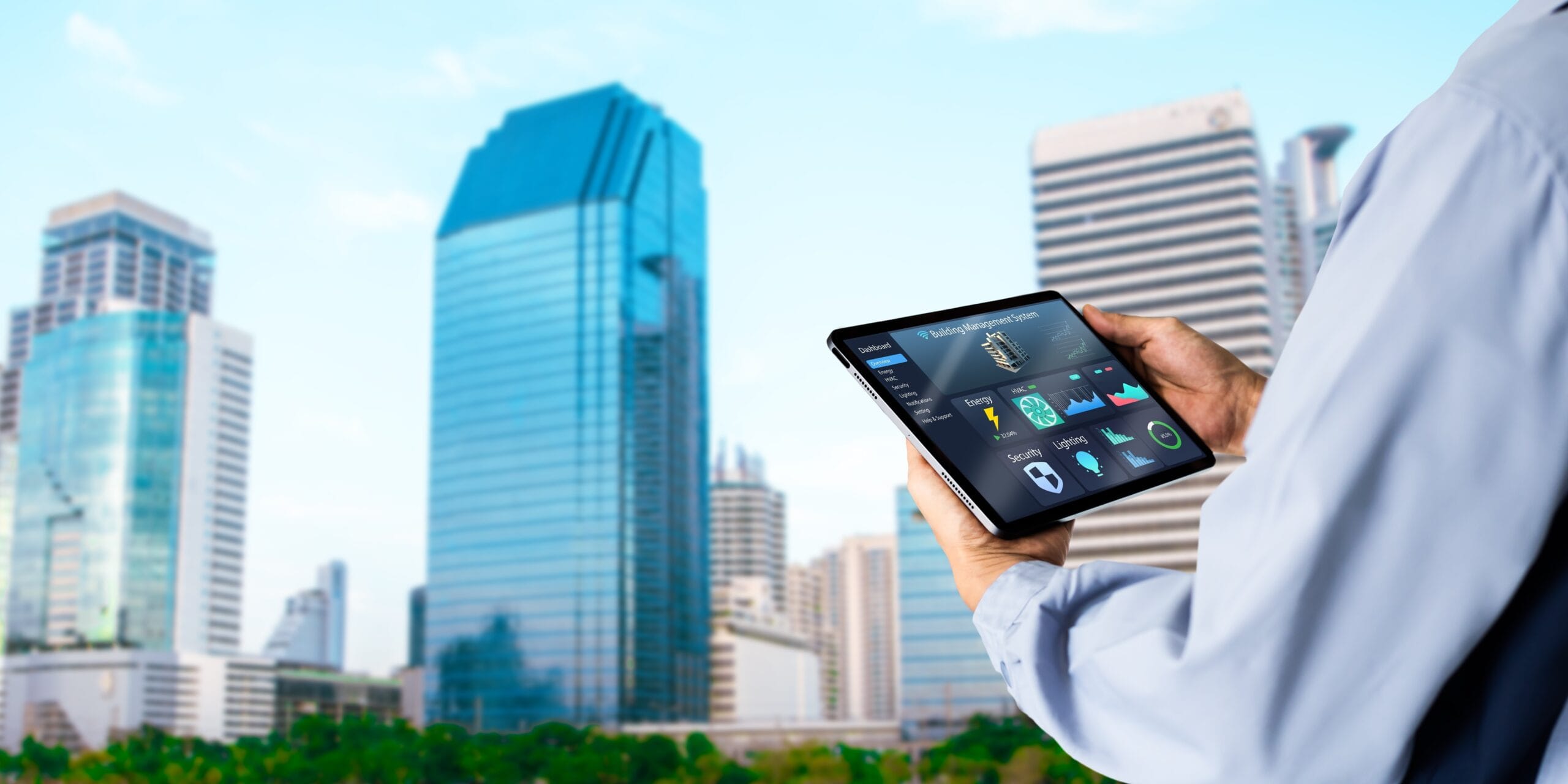 Engineer monitoring energy performance of sustainable commercial buildings using smart shading and automation systems